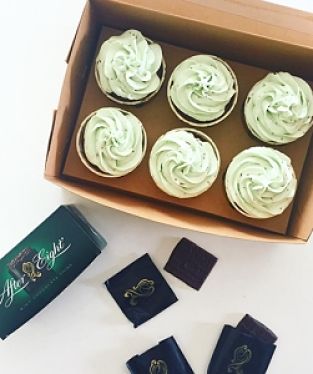 A box, with six Peppermint Chocolate cupcakes, surrounded by Nestle After Eight Mint Chocolate Thins